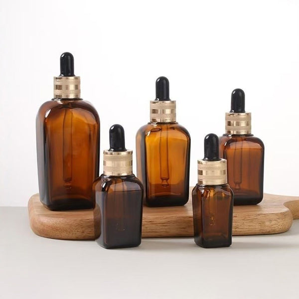 ขวดแก้ว ดรอปเปอร์ สีชา ทรงเหลี่ยม ฝาสีทอง จุกบีบสีดำ ขนาด 10, 15, 20, 30, 50, 100 ml.